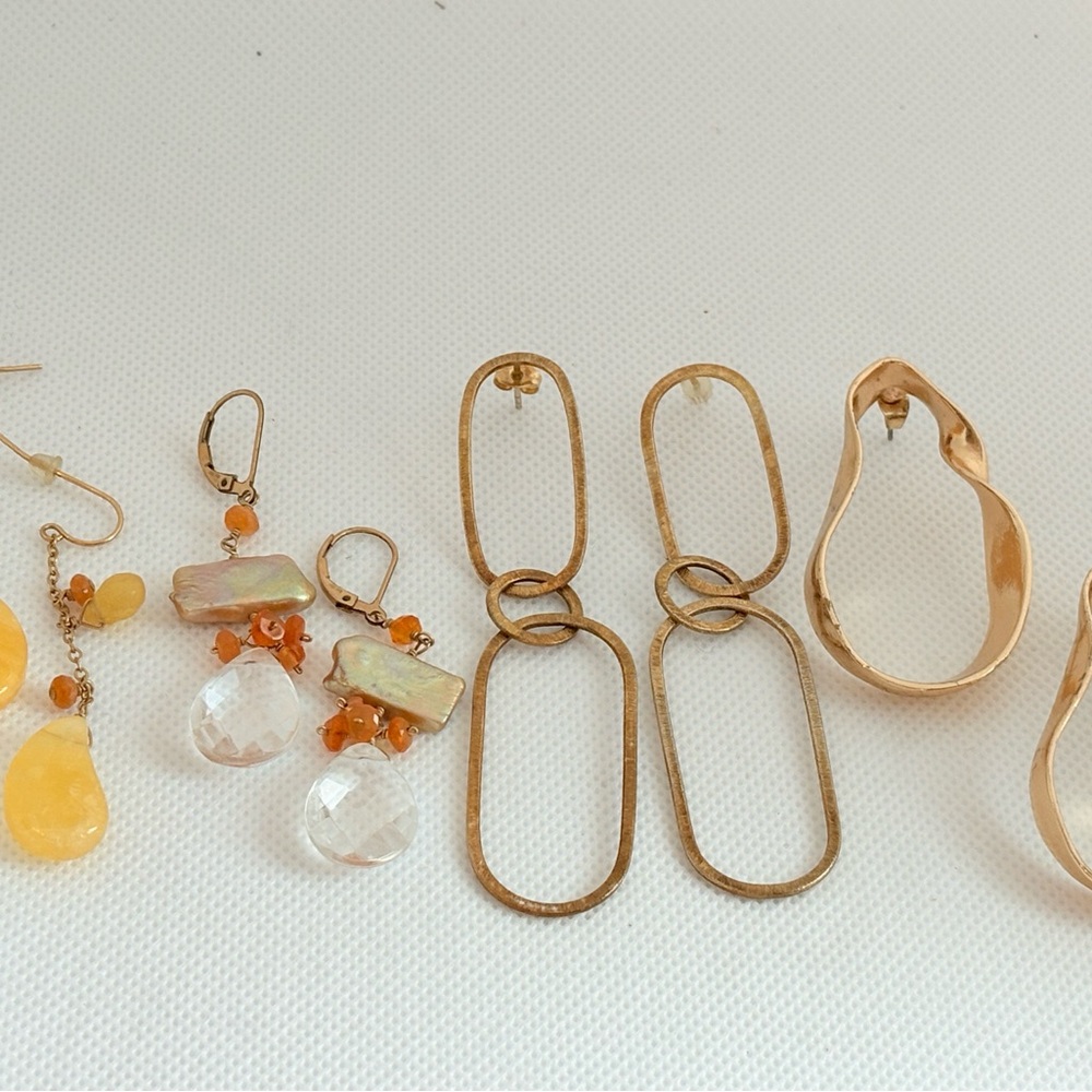 Gold tone earring lot: dangle, delicate and bold